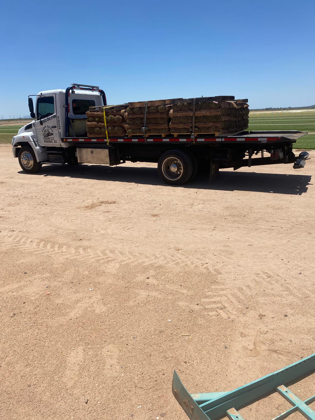 Keep Going flatbed transporting secured equipment in Phoenix